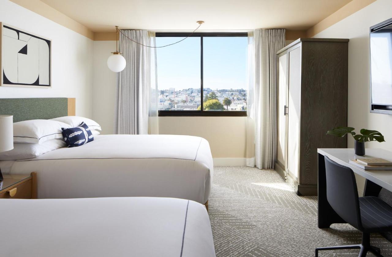 Essential Queen Room with Two Queen Beds and City View